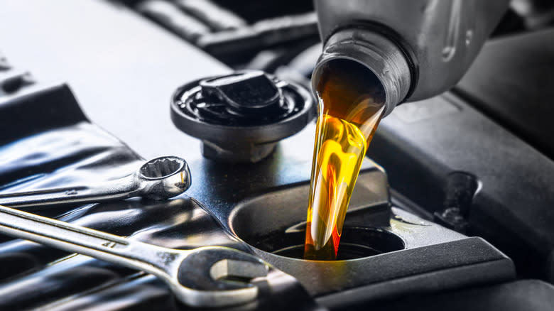 Engine oil is poured to the engine