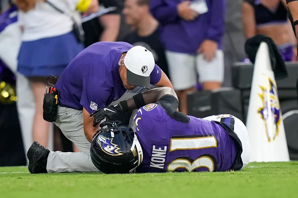 Baltimore Ravens cornerback Bilhal Kone is checked by a medical staff member after going down on a play against the Indianapolis Colts during the firs half of an NFL preseason football game Thursday, Aug. 7, 2025, in Baltimore. (AP Photo/Alex Brandon)