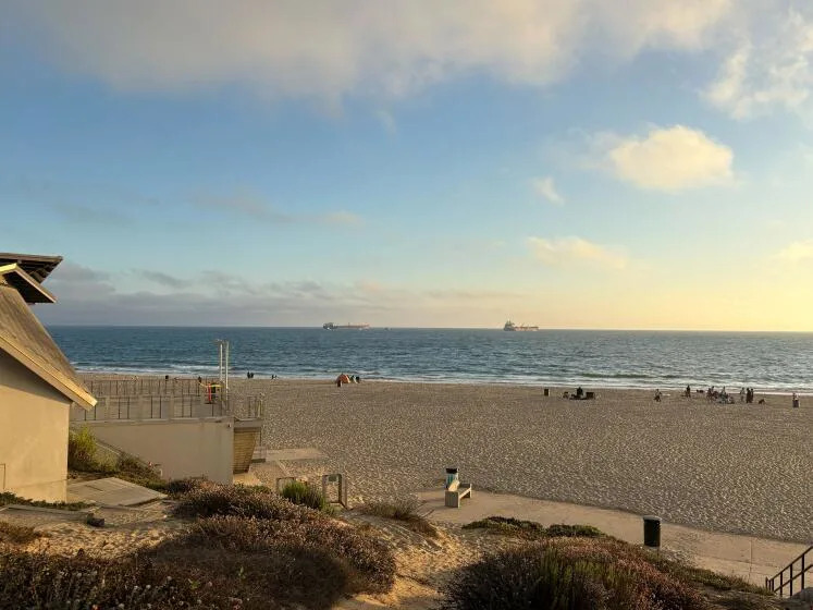 Residents spoke from Dockweiler Beach on Tuesday afternoon, when the waters were calm hours before a possible tsunami arrives from a magnitude 8.8 earthquake off the east coast of Siberia, in Los Angeles on Tuesday, July 29, 2025.