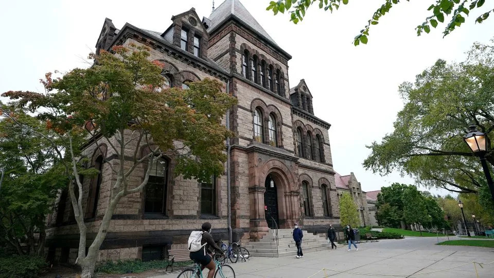 People traverse Brown University campus in Providence, Rhode Island, on October 12, 2020. - Steven Senne/AP