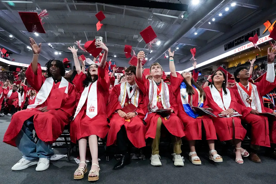 Seniors throw their caps into the air at the conclusion of the Iowa City City High School graduation May 31, 2025 at Xtream Arena in Iowa City, Iowa.