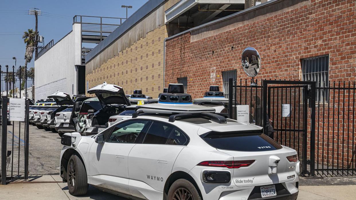 dozens of new driverless waymo cars on the streets and inside the garage on west los angeles.