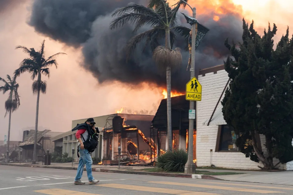 Structures burn in the Pacific Palisades neighborhood on Jan. 8, 2025, after a wildfire broke out in Los Angeles County, California on Jan. 7.