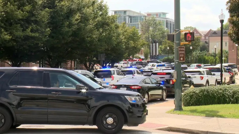 Law enforcement respond to reports of shots fired at the University of Tennessee at Chattanooga on August 21. - WTVC
