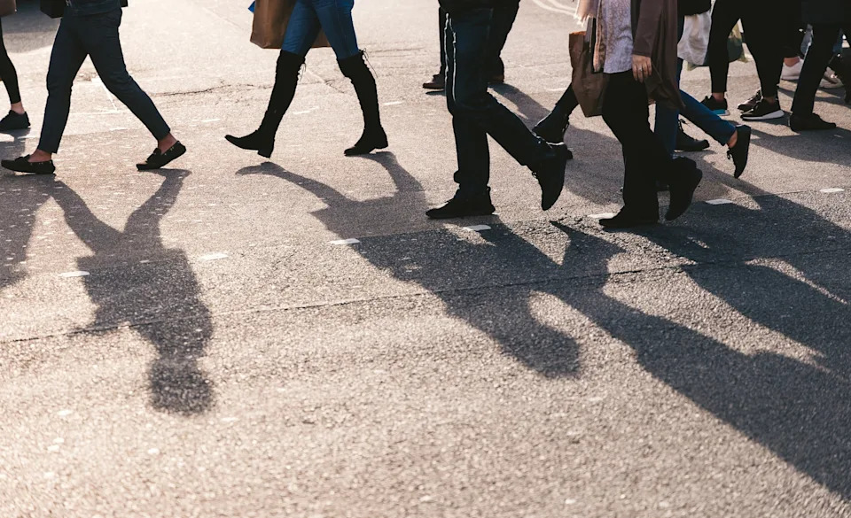 STOCK PHOTO/Adobe - PHOTO: People walk in a city in an undated stock photo.