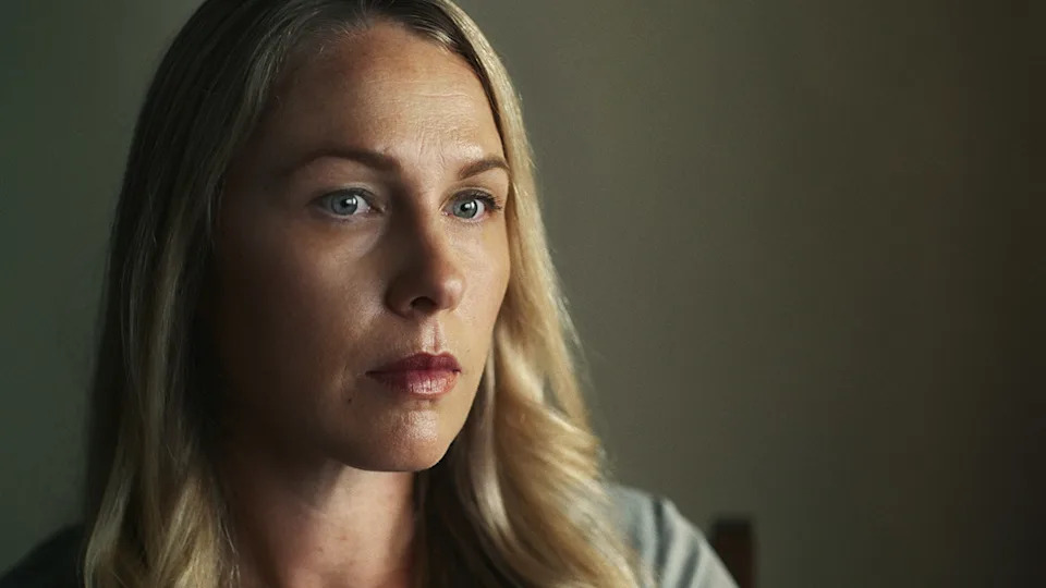 A close-up of Denise Huskins looking serious.