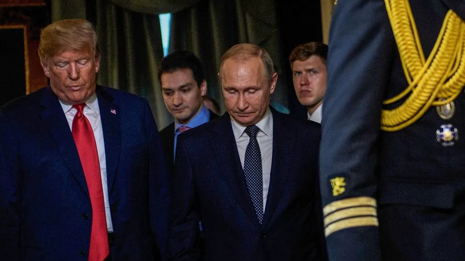 US President Donald Trump and Russian President Vladimir Putin arrive for a meeting at Finland's Presidential Palace in Helsinki, Finland, on July 16, 2018. - Brendan Smialowski/AFP/Getty Images/File