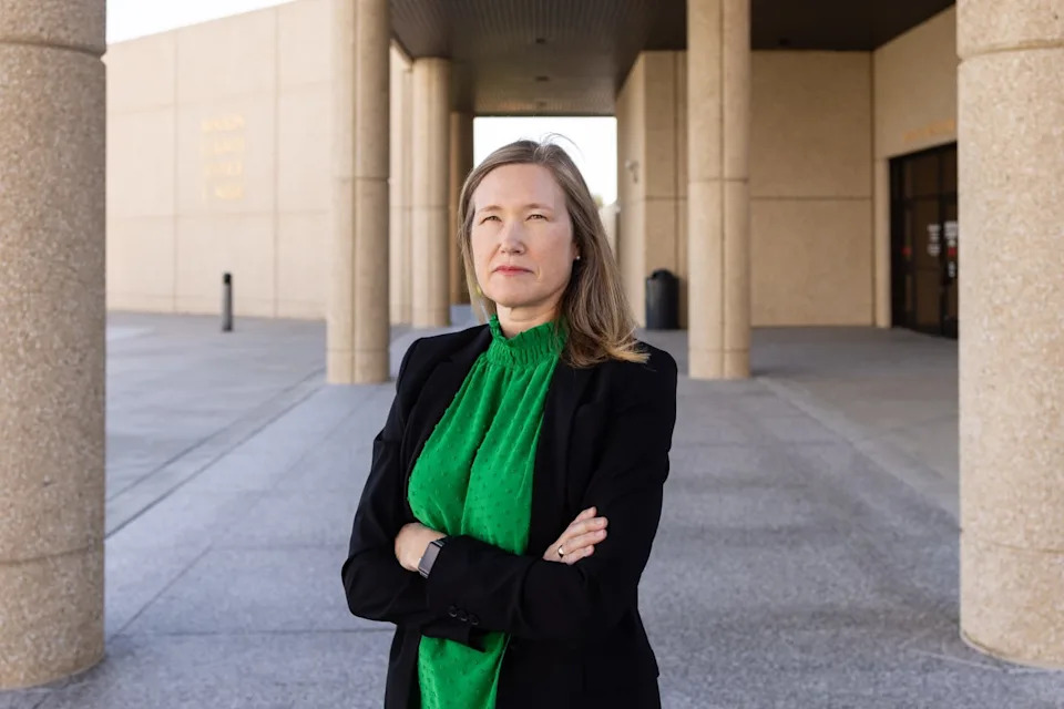 Karla Carlisle, a managing attorney with the nonprofit legal aid program Northwest Justice Project, stands outside the Benton County Justice Center in Kennewick, Wash. Some judicial officers in Washington state, including Benton County, stopped ordering alleged domestic abusers to surrender their guns following a 2022 Washington State Court of Appeals decision. Carlisle hopes that a Court of Appeals ruling issued on June 30 will change that. (Photo by Emree Weaver/InvestigateWest)