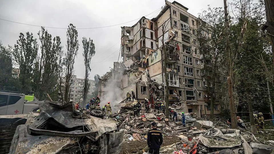 Rescuers work at the site of a residential building destroyed by a direct hit from a Russian cruise missile during missile and drone strikes amid Russia's ongoing attack on Ukraine, in Kyiv, Ukraine, on July 31, 2025