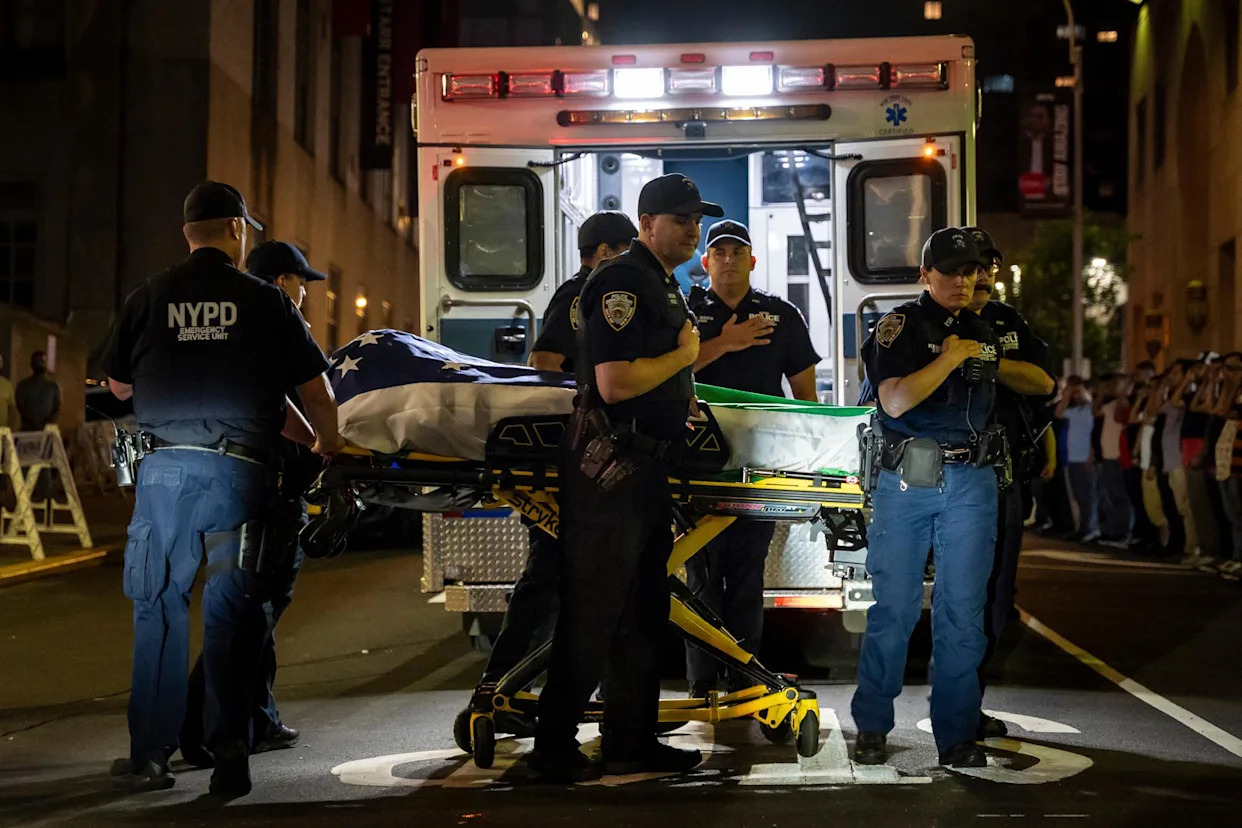 <span>Police officers bring out the body of Didarul Islam from a hospital in New York on Tuesday.</span><span>Photograph: Angelina Katsanis/AP</span>