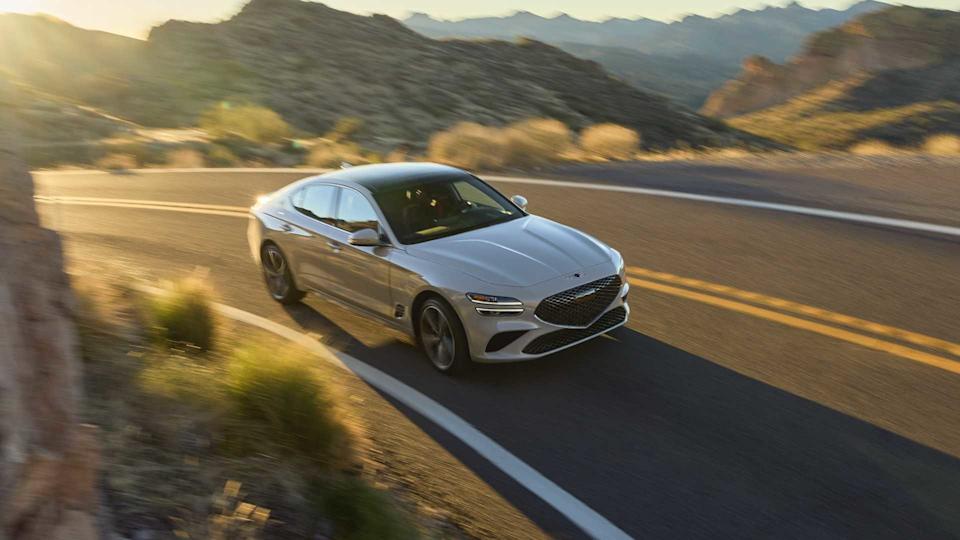 Front 3/4 action shot of a 2025 Genesis G70