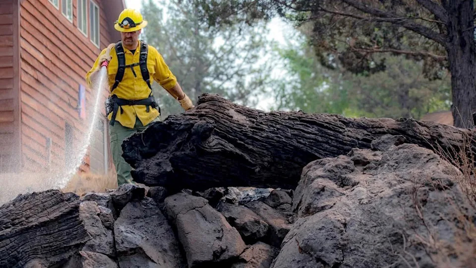 Firefighter spraying water