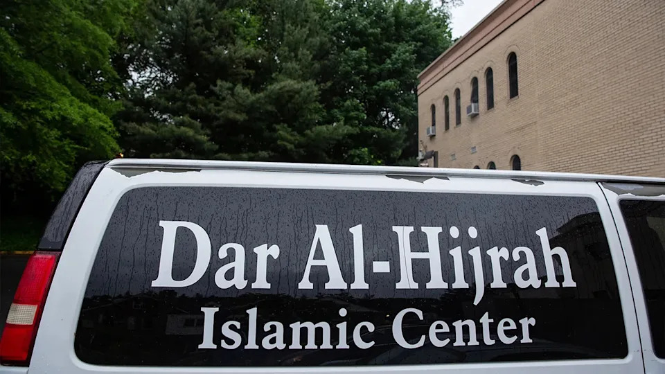 A vehicle is parked outside the mosque with a Dar Al Hijrah Islamic Center sign on it in Falls Church, Virginia, U.S.