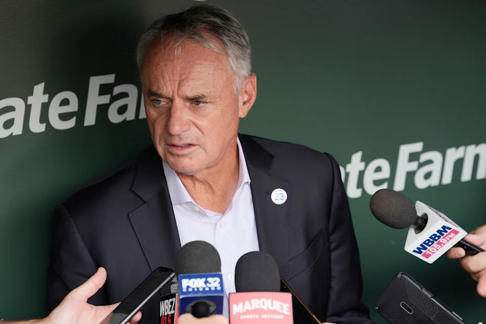 CHICAGO, ILLINOIS - AUGUST 01: Major League Baseball Commissioner Rob Manfred is interviewed during the 2027 Chicago All-Star Game Announcement before a game between the Baltimore Orioles and Chicago Cubs at Wrigley Field on August 01, 2025 in Chicago, Illinois. (Photo by Patrick McDermott/Getty Images)