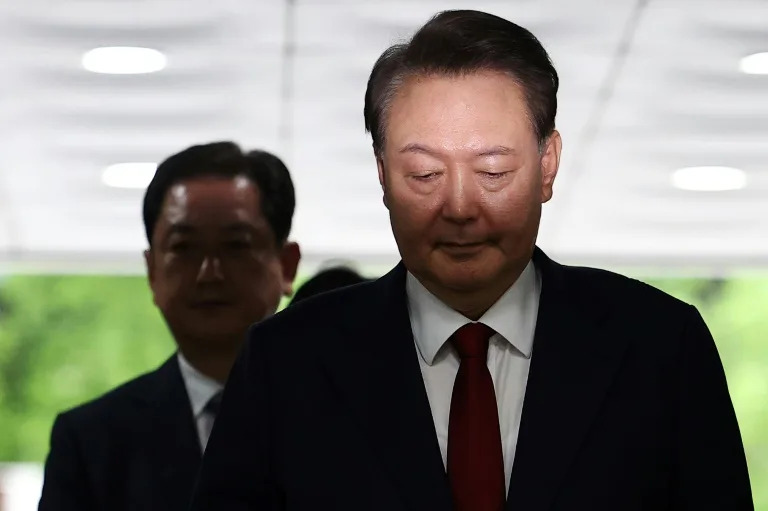 South Korea's Yoon resists questioning by lying in underwear