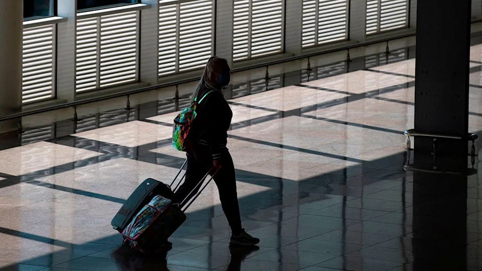 A woman walking in Josep Tarradellas Barcelona-El Prat Airport