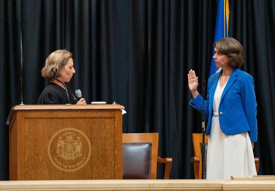 (Left) Wisconsin Chief Justice Jill Karofsky conducts the Administration of the Oath of Office for (right) Justice Susan Crawford on Friday August 1, 2025 at the Wisconsin State Capitol in Madison, WI.