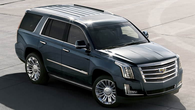 A forest green 2020 Cadillac Escalade sitting on a plaza