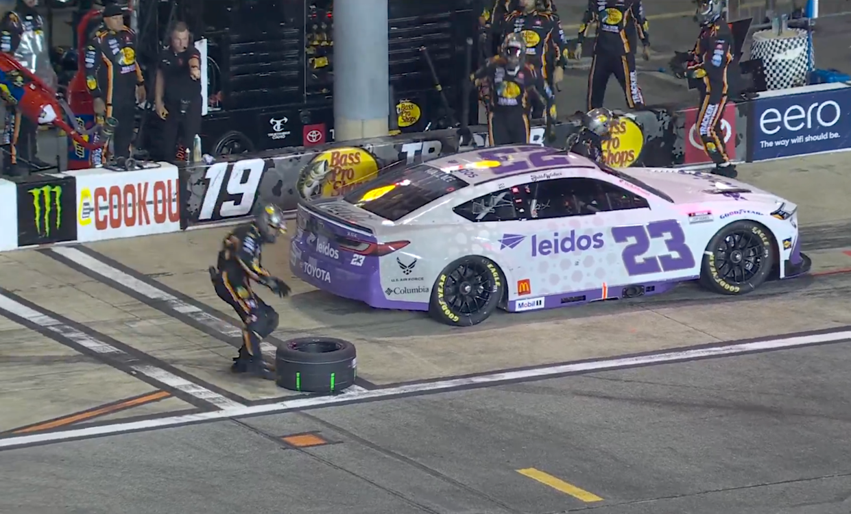 Toyota Teamwork, JGR Pit Crew Reattach Wheel to 23XI Racing Bubba Wallace's Car