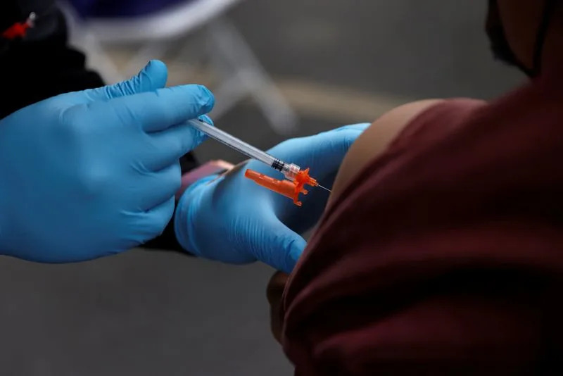 US insurers likely to cover updated COVID shots this year, industry sources say