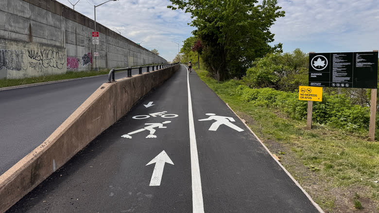 Bike lane and pedestrian lane icons on newly opened Cherry Walk in Riverside Park, Manhattan, New York City