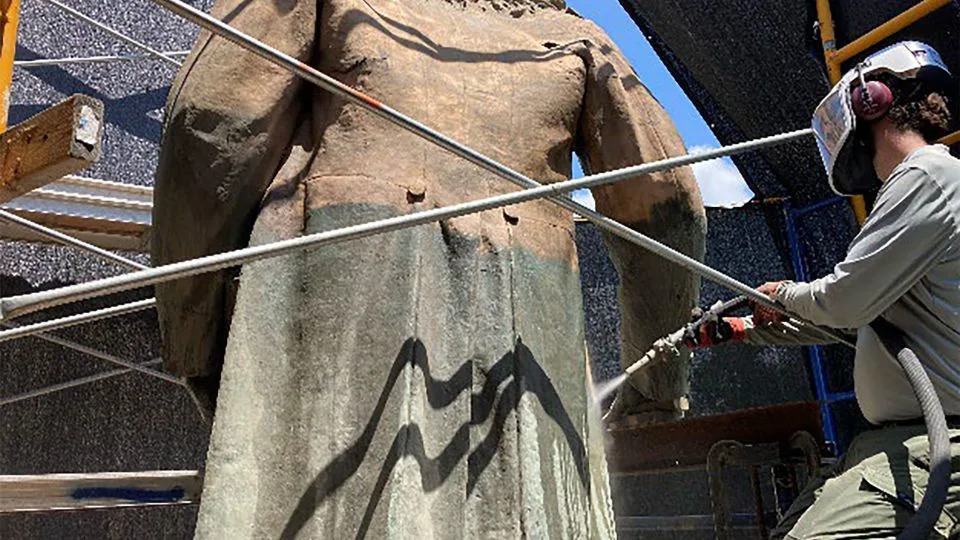 Micro-abrasive cleaning of the Albert Pike statue to remove corrosion and paint in order to review the conditions of the bronze prior to repairs - National Park Service