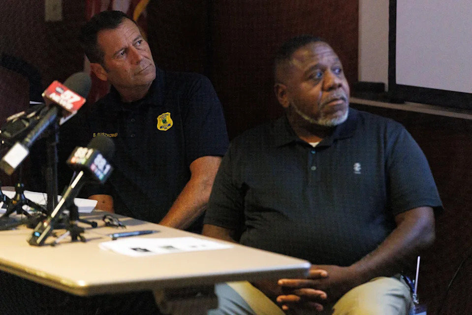 South Bend Chief of Police Scott Ruszkowski, left, and police Capt. David Herron watch body camera footage from an incident that took place on Aug. 15 being played for members of the media at the department's headquarters on Wednesday, Aug. 20, 2025, in South Bend.