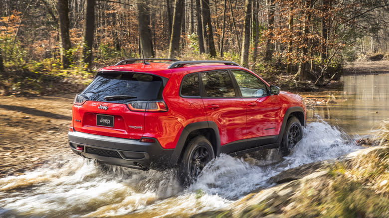 Jeep Cherokee Trailhawk crossing a stream