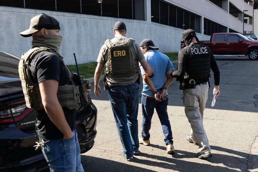 STAMFORD, CONNECTICUT - JULY 03: Agents from Immigration and Customs Enforcement (ICE) detain an immigrant after a court hearing at the Connecticut Superior Court on July 03, 2025 in Stamford, Connecticut. Masked federal officers, including ICE and FBI agents staked out the court facility and detained multiple immigrants following their court appearances. ERO stands for Enforcement and Removal Operations, a division of ICE. (Photo by John Moore/Getty Images)