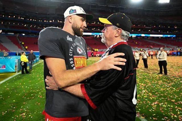 Kathryn Riley/AP Travis and Ed Kelce