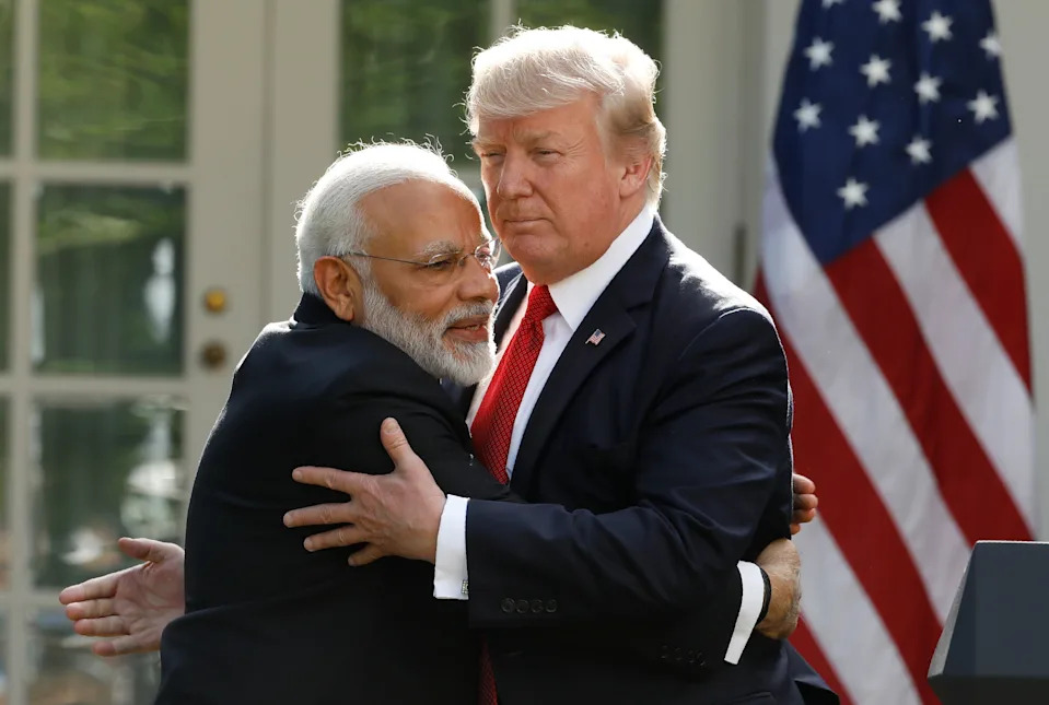 India's Prime Minister Narendra enjoyed a warm relationship with President Donald Trump until the relationship soured over the president's trade war. Here, Modi is pictured hugging Trump during a 2017 press conference at the White House Rose Garden. / REUTERS/Kevin Lamarque / Reuters
