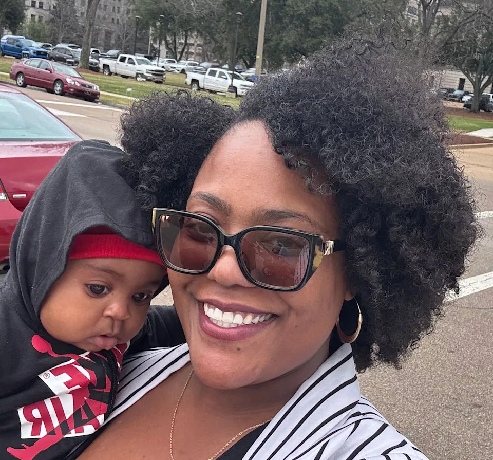 Shequite Johnson poses with newborn Noah on a work trip in Jackson, Miss., on Feb. 12, 2025. (Shequite Johnson)