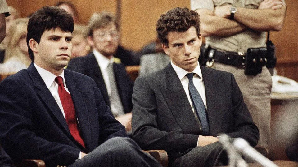 Lyle Menendez, left, and his brother, Erik, sit in Beverly Hills Municipal Court in Beverly Hills, California, on March 12, 1990. - Nick Ut/AP