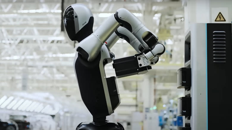 A humanoid robot changing its battery pack in China