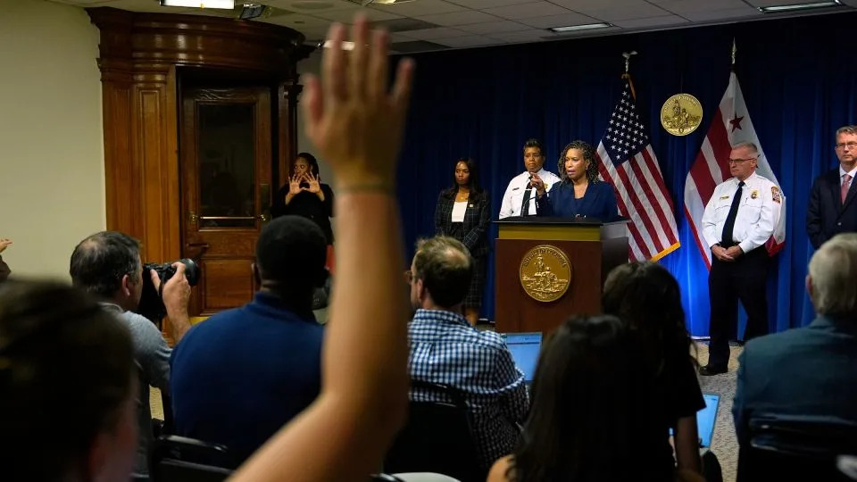 District of Columbia Mayor Muriel Bowser speaks as Metropolitan Police Department Chief Pamela Smith, on stage third left, and DC Fire and EMS Chief John Donnelly, on stage second right, listen during a news conference on August 11 in Washington, DC. - Julia Demaree Nikhinson/AP