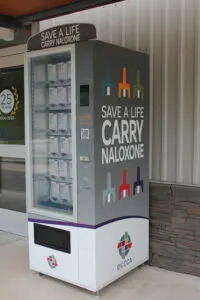  DCCCA offers naloxone through a vending machine outside of a Lawrence Transit station near the University of Kansas campus. (Maya Smith for Kansas Reflector)