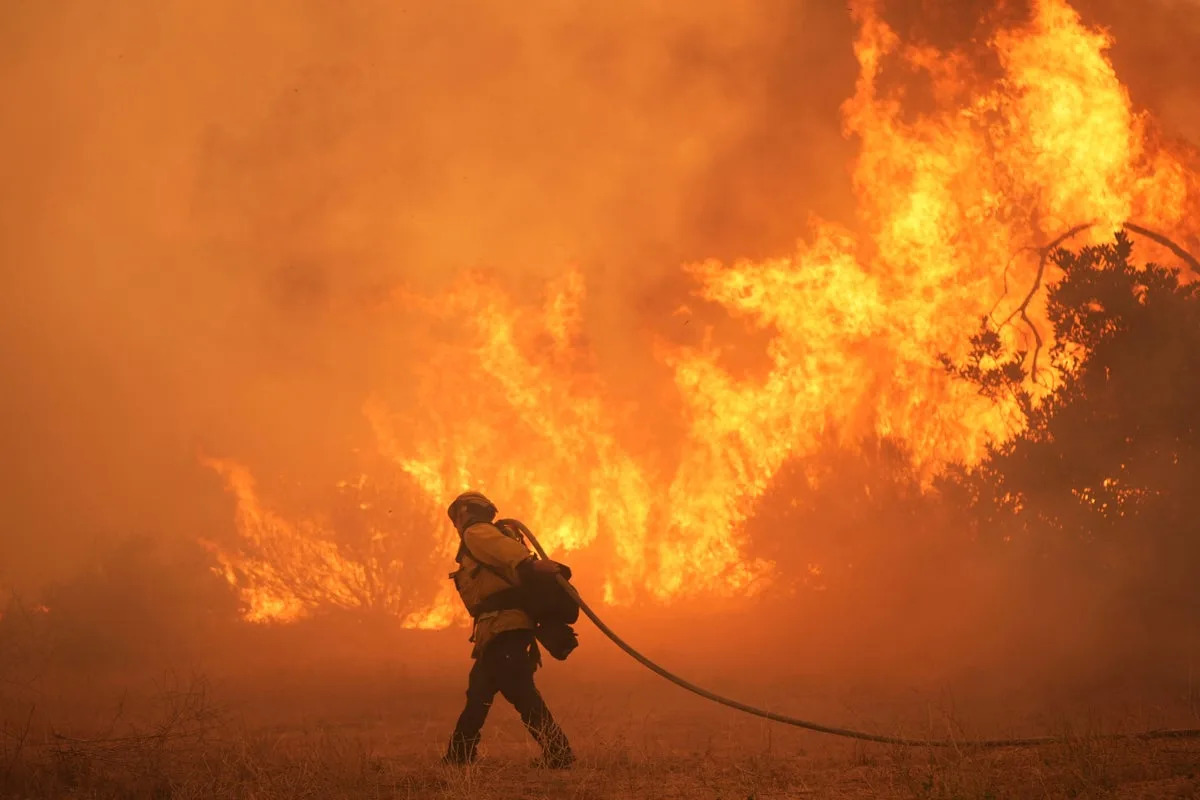 Thousands forced to evacuate in Southern California as fast-moving fire spreads
