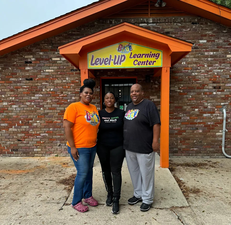Level-Up Learning Center leadership team poses in front of their Greenville, Miss., location on July 26, 2024. Left to right are Chief Operating Officer Adrienne Walker, CEO Kaysie Burton and COO/Athletic Director Kwame Malik Barnes. (Level Up Learning Center)