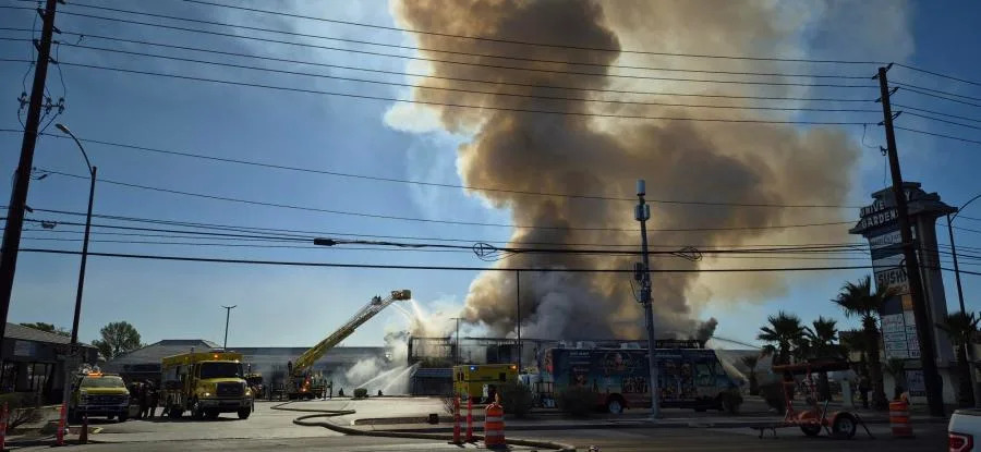 Clark County fire crews battle a large blaze at a business complex across the street from the UNLV campus on Maryland Parkway, near Tropicana Avenue on July 25, 2025. (KLAS)