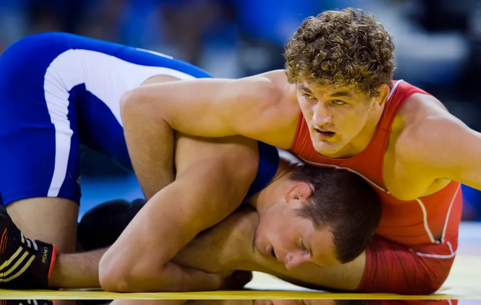 Ben Askren of the United States, in red, battles Istvan Vereb of Hungary in men's freestyle 74kg qualification matches on Wednesday, August 20, 2008, in the Games of the XXIX Olympiad in Beijing, China. (Photo by David Eulitt/Kansas City Star/Tribune News Service via Getty Images)
