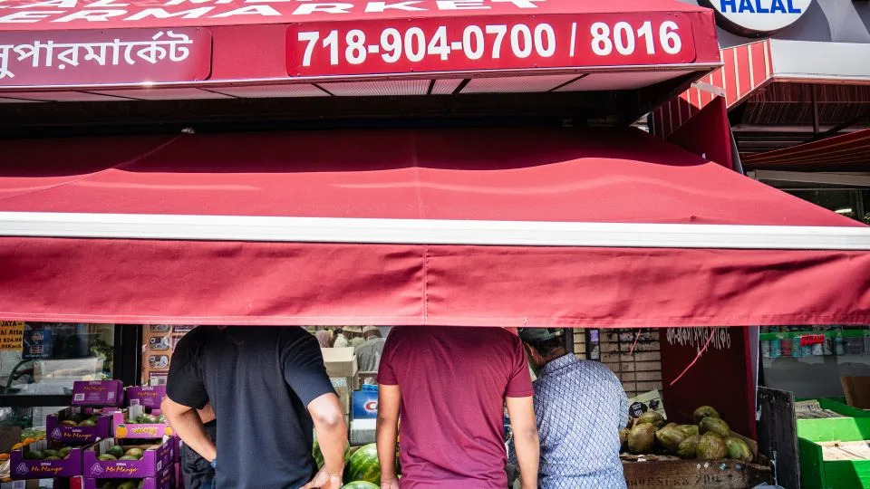 People shop for produce at the Al-Aqsa Supermarket. - Timothy Fadek for CNN