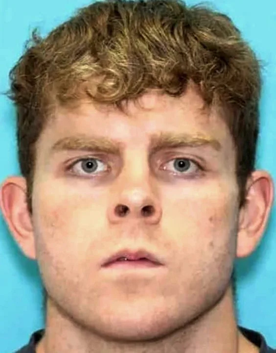 This undated photo provided by the Arkansas State Police shows Andrew James McGann, 28, of Springdale, Ark. who was arrested in connection to a double homicide that occurred on Saturday, July 26, 2025, at Devil’s Den State Park. (Arkansas State Police via AP)