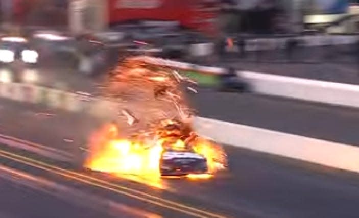 car crash resulting in explosion on a racetrack