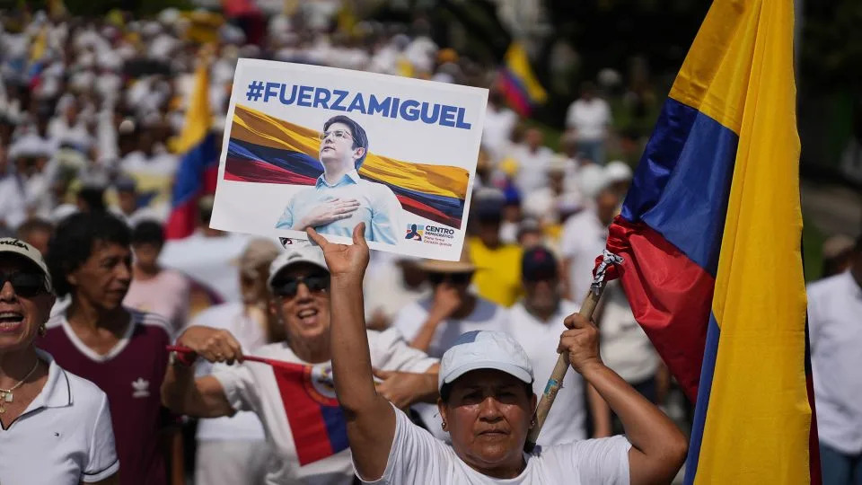 People hold up banners of presidential pre-candidate Miguel Uribe Turbay during a protest to demand a reduction in violence in Cali, Colombia on June 15, 2025. - Edwin Rodriguez Pipicano/Anadolu/Getty Images