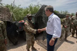 Gov. Jim Pillen on a 2024 visit to the Texas-Mexico border. He visits with members of the Nebraska National Guard, whom he deployed to help Texas patrol its border. (Photo courtesy of the Nebraska Governor’s Office)