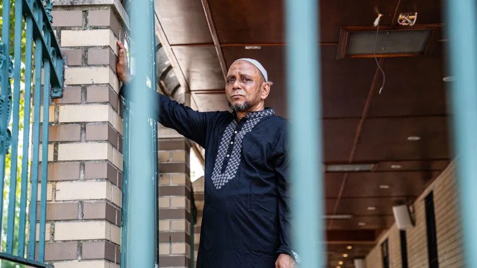 A man stands inside the compound of the Parkchester Jame Masjid Mosque. Islam's body was transferred there on Tuesday. - Timothy Fadek for CNN