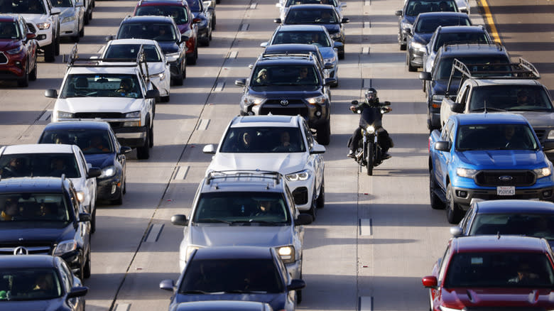 Motorcyclist filtering traffic in San Diego