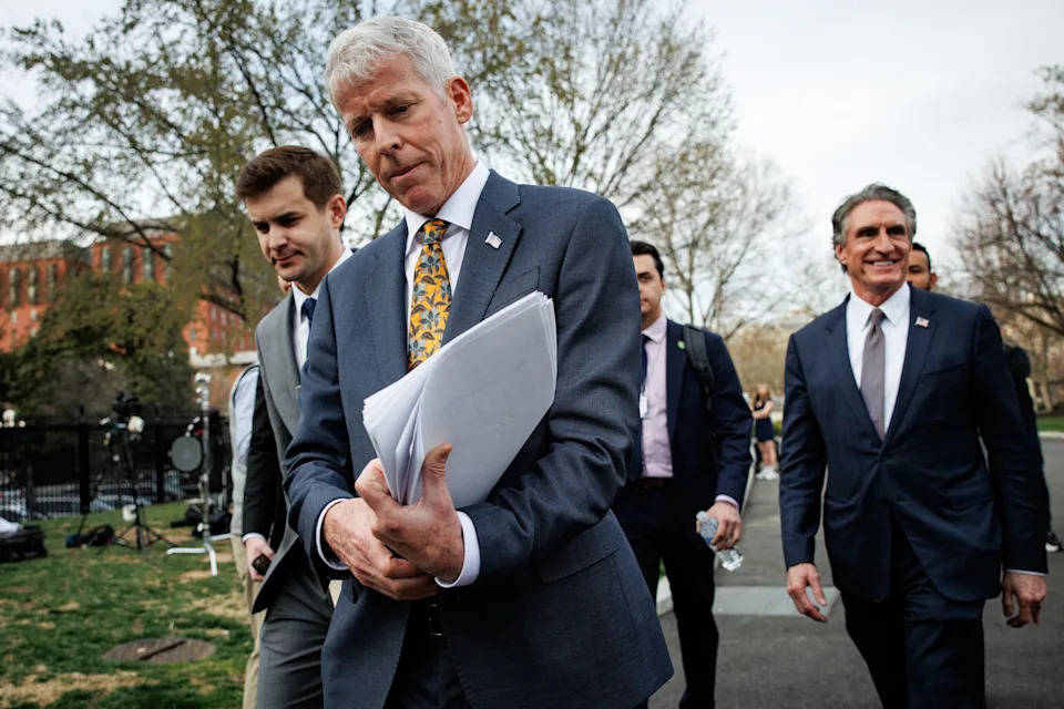 Energy Secretary Chris Wright, center, with Interior Secretary Doug Burgum, right, outside the White House on March 19, 2025.  / Credit: Samuel Corum/Sipa/Bloomberg via Getty Images