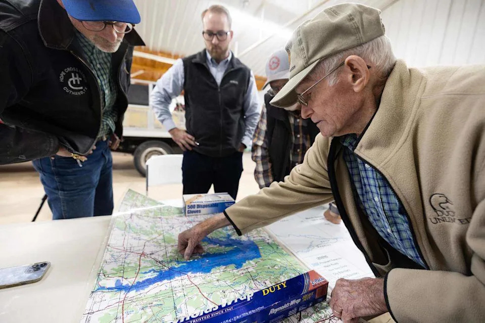 Cuthand residents look over maps that show the areas flooded in the proposed Marvin Nichols Reservoir Project. Locals living in Cuthand, Texas – where the project would be located – and surrounding towns have campaigned to get the project removed from the state water plan.