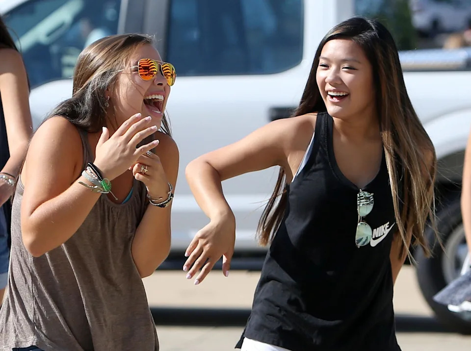 Young women laugh as they make their way to Bryant-Denny Stadium for the University of Alabama's Panhellenic Bid Day on Saturday, Aug. 19, 2017. Of the 2,589 young women that participated in UA's Panhellenic Fall recruitment, 2,338 received bids for one of the 16 sororities during UA's annual Bid Day in Tuscaloosa.  [Staff Photo/Erin Nelson]